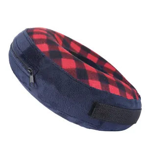 Inflatable pet recovery collar detail, soft blue plush and red plaid fabric with adjustable strap.