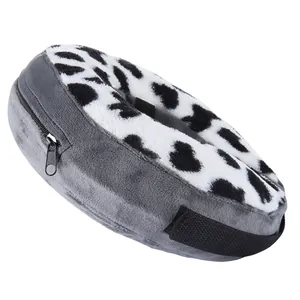 Detailed close-up of pet inflatable Elizabethan recovery collar, soft grey and cow print plush.