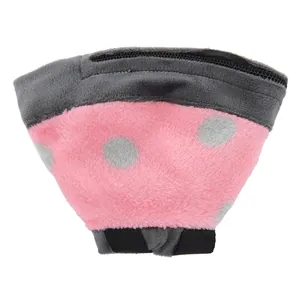 Plush pet recovery collar detail, pink with grey polka dots, soft fabric for safe pet healing.
