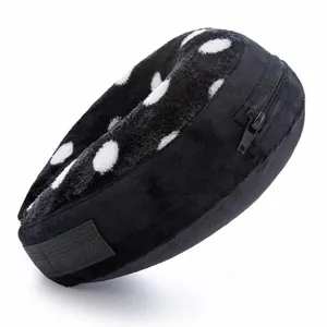 Black and white polka dot plush inflatable pet recovery collar detail view, soft dog cone.