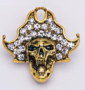 Detailed view of rhinestone encrusted pirate skull alloy brooch, gothic Halloween piece.