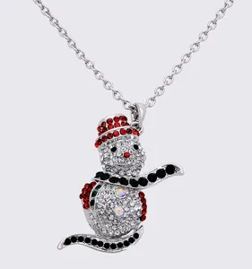 Close-up detail of the sparkling Christmas snowman rhinestone pendant necklace sparkle accessory.