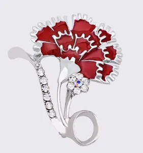 Exquisite red enamel carnation brooch detail featuring sparkling rhinestones and alloy finish.