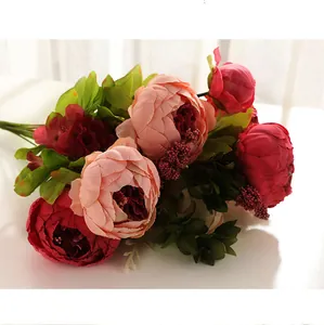 Detailed view of artificial peony flower bouquet faux silk floral arrangement for home decor.