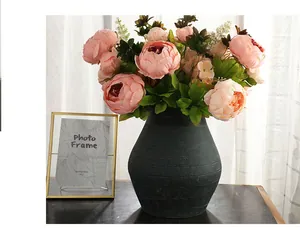 Detailed view of 13-head artificial peony flower arrangement in elegant vase for decor.