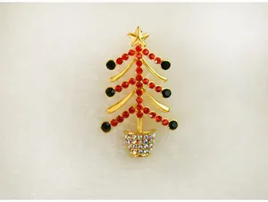 Broche sapin de noël ton or strass rouges et noirs bijoux de fête cadeau de vacances chic