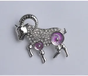 Detailed view of the sparkling rhinestone ram brooch, silver alloy zodiac animal pin.
