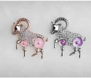 Detailed shot of sparkling rhinestone zodiac sheep brooch in alloy enamel finish.