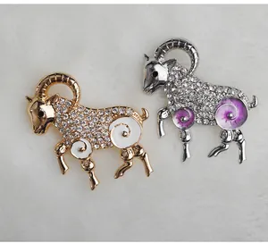 Detail view of a stunning zodiac ram brooch featuring sparkling rhinestones and elegant enamel.