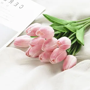 Beautiful artificial pink tulip bouquet faux flowers for home room decor spring arrangement.