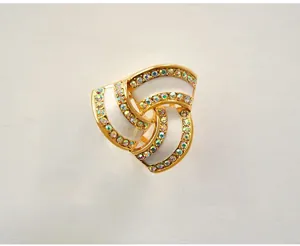 Close-up detail of three-ring rhinestone scarf buckle in zinc alloy, elegant design.