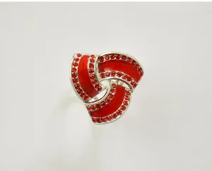 Detail of the chic three-ring scarf buckle with sparkling red rhinestones and silver-tone alloy.