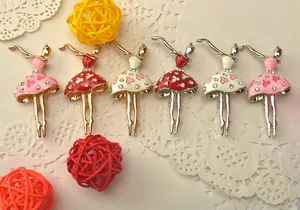 Elegant ballerina girl brooch featuring sparkling rhinestones and colorful dresses.