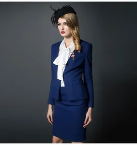 Detailed shot of an elegant alloy enamel ballet dancer brooch pinned on a blue suit lapel.