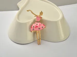 Elegant ballet dancer brooch featuring pink enamel dress and sparkling rhinestone details.