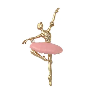 Detailed close-up of a sparkling rhinestone ballerina brooch with pink enamel skirt.
