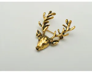 Vintage gold deer head brooch detail shot, perfect for clothing accessories and holiday gifts.