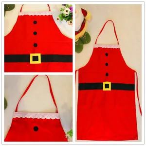 Christmas apron detail view showing red fabric, white lace trim, and classic belt design.