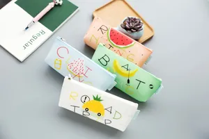 Silicone pencil case detail view, cute fruit patterns, triangle stationery storage pouch.