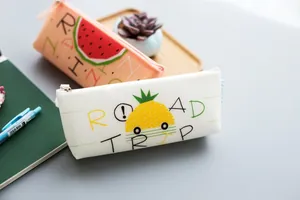 Silicone pencil case detail, cute fruit prints, triangular storage bag for student stationery.