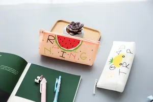 Cute silicone pencil case with fresh fruit pattern triangular storage pouch for school kids.