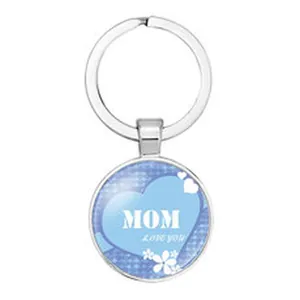 Detailed macro view of a circular pendant keychain featuring MOM Love You heart design