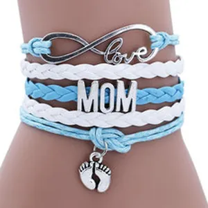 Close-up of MOM multi-layer braided bracelet with infinity love charm and baby feet pendant