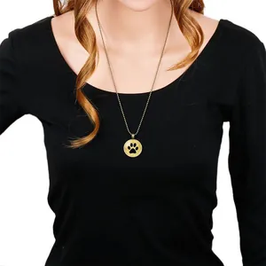 Vintage bronze ball chain necklace featuring a cute black paw print pendant accessory.