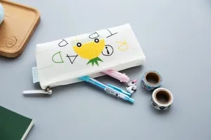 White silicone pencil case with pineapple print and secure zipper closure for students.