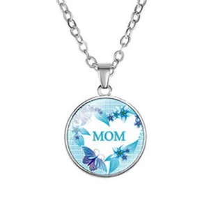 Close-up detail of Mother's Day gift necklace featuring blue MOM heart floral pendant