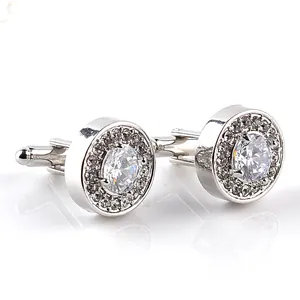 Elegant silver-tone round cufflinks featuring dazzling clear rhinestones, perfect for formal wear.