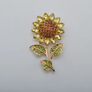 Macro shot of a vintage sunflower brooch with sparkling yellow and green crystals