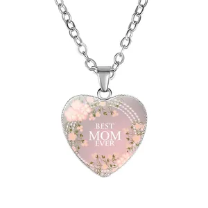 Detailed view of silver heart pendant necklace with pink floral pattern and best mom text.