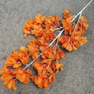 Kunstmatige oranje kersenbloesem tak met witte stengel neobloemen voor thuis bruiloft