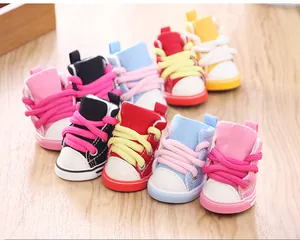 Detailed view of colorful mini pet canvas shoes with cute laces and non-slip soles for small dogs.