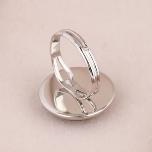 Detailed macro view of silver adjustable ring base with round flat bezel setting