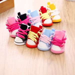 Cute pet canvas shoes for small dogs, non-slip breathable puppy sneakers with lace-up design.