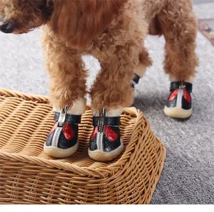Warm winter pet dog shoes with anti-slip soles and soft plush lining, perfect for small dogs.