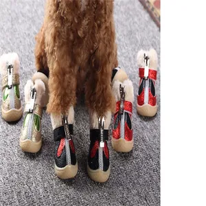 Winter warm pet shoes with soft fleece lining, front zipper design and anti-slip rubber soles.