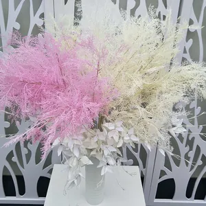Artificial frosted pine branches wedding background floral decor pink white details view