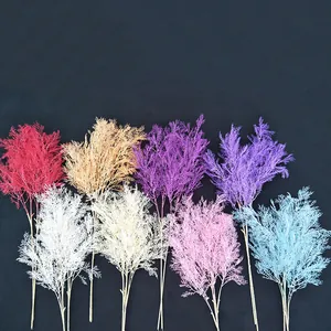 Artificial rime pine branch detail, colorful decorative plant for wedding and home decor.