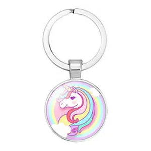 Detailed close-up view of a silver circular keychain featuring a colorful rainbow unicorn