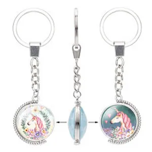 Double-sided rotatable unicorn keychain pendant with colorful floral fantasy illustrations
