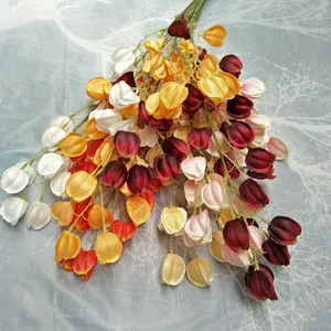 Detailed close-up view of colorful artificial lantern fruit bouquet for home decor.