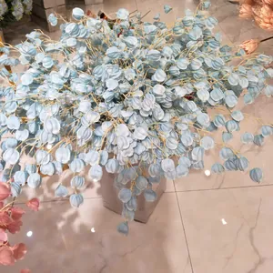 Detailed view of light blue artificial lantern flower branches in a grey pot for decor.