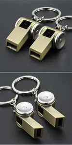 Metal retro whistle keychain detail, close-up view of the vintage pendant and key ring.