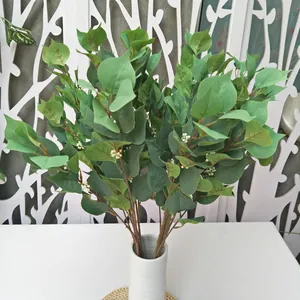 Artificial eucalyptus leaves branch for home wedding decor plant wall backdrop green plant.