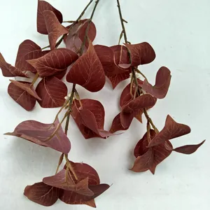 Detailed view of artificial red eucalyptus leaves, perfect for home and wedding decor.