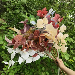 Artificial leaves branches colorful fake plant foliage for wedding home wall decor display.