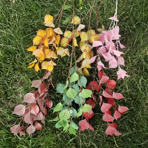 Artificial bodhi leaf branches detail, colorful faux plant foliage for home and wedding decor.